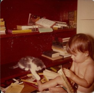 Carol James as a young child "reading" books.
