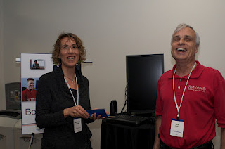 Kristina Pappas and Rob Turner from Bookshare standing in front of one of the demo stations.