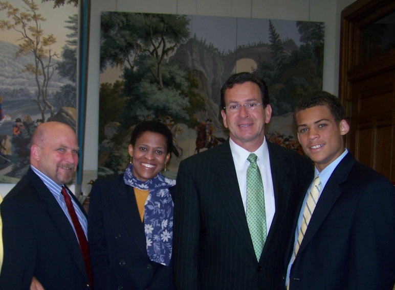 4 people standing together; Jeffrey's parents, Connecticut Governor Dannel Malloy, and Jeffrey