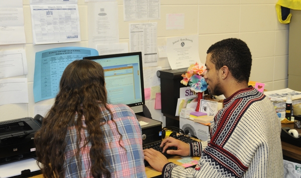 two students sitting in  front of a computer