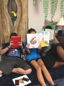 Students in Ms. Wilson's reading center with books and portables.