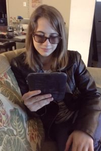 Veronica Lewis reading an ebook on a tablet