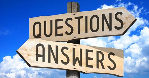 Questions appears on one sign and answers appears on a second sign