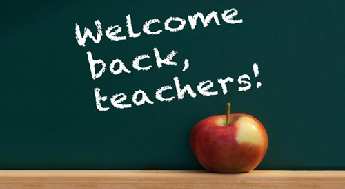 welcome back, teachers is written on a chalkboard above an apple
