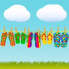 Five pairs of flip flops are hanging on a clothesline with clouds above