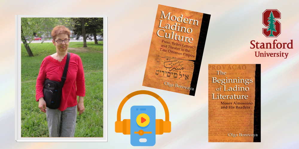 Olga Borovaya wears glasses and stands near some trees with the Stanford logo and her books: Modern Ladino Culture and The Beginnings of Ladino Literature